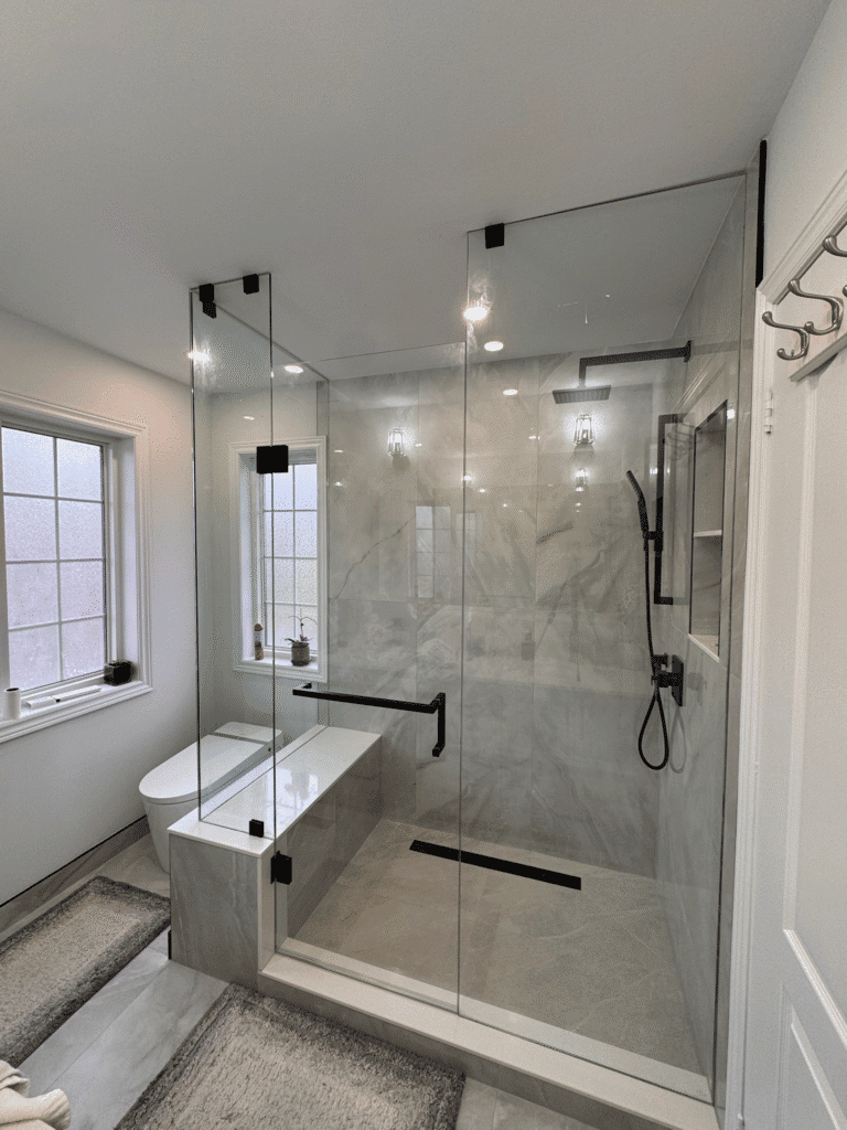 Frameless glass shower enclosure in Thornhill, sleek finishes, uninterrupted sightlines, and spa-like atmosphere created by Zelux Railings for modern bathrooms across the GTA.