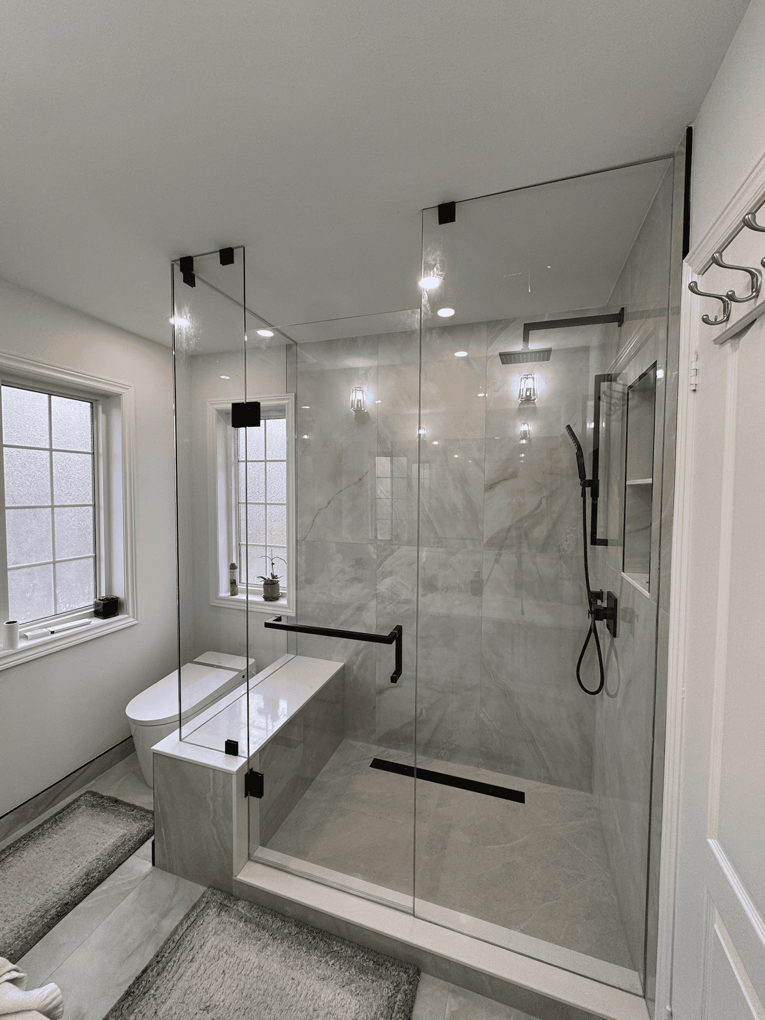 Frameless glass shower enclosure in Thornhill, sleek finishes, uninterrupted sightlines, and spa-like atmosphere created by Zelux Railings for modern bathrooms across the GTA.