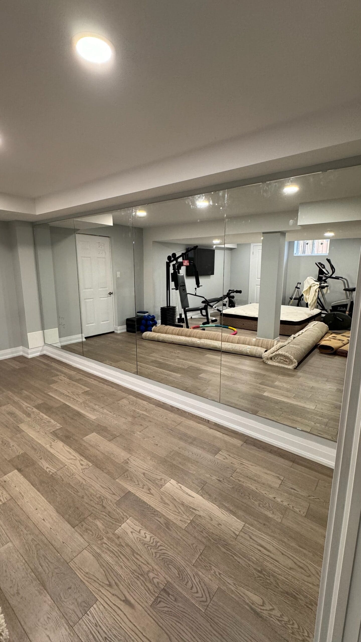 Gym mirror wall installation